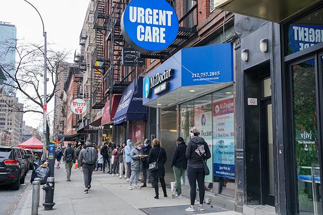 New Yorkers wait outside an urgent care office for Covid-19 testing. 